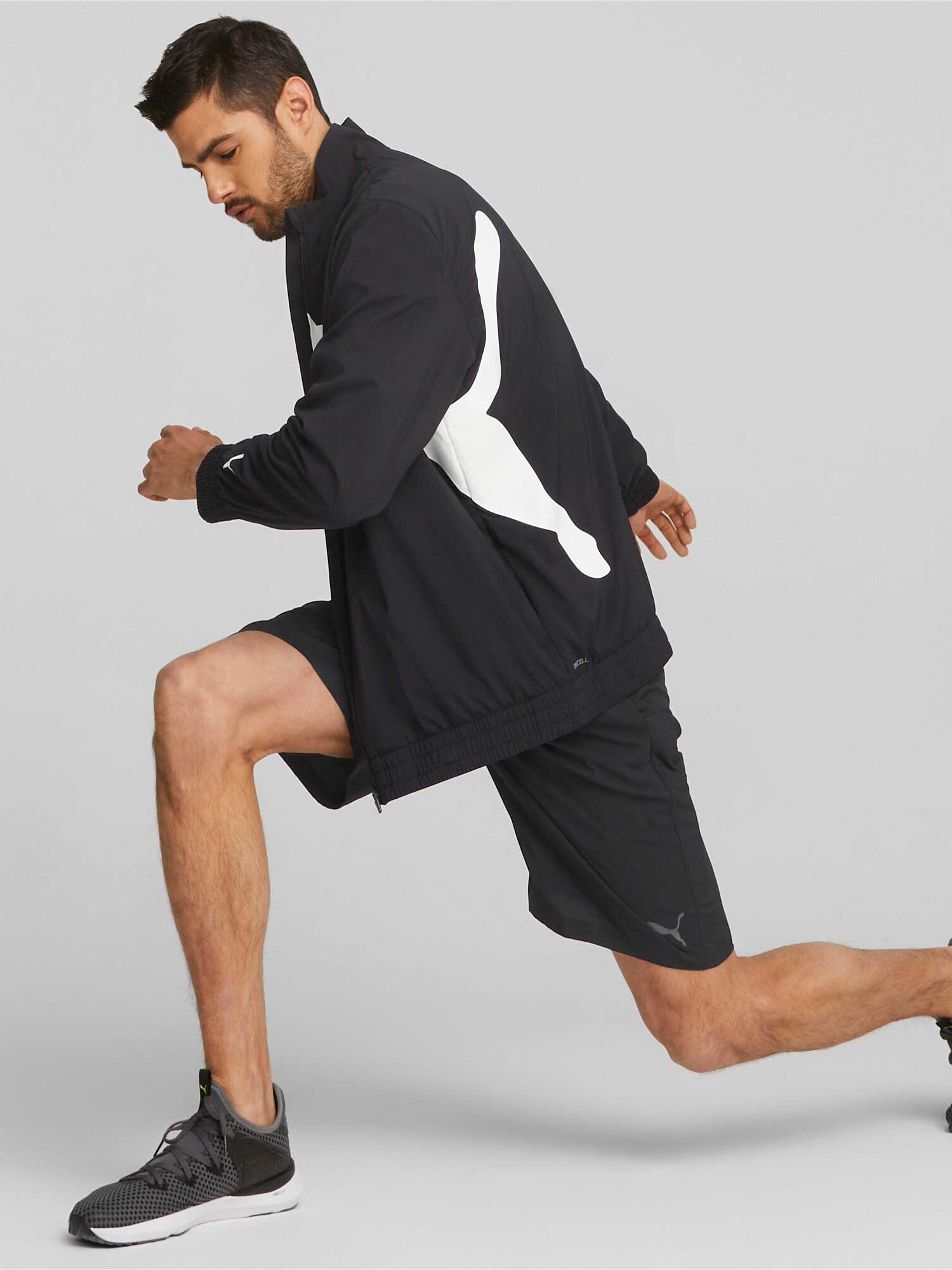 PUMA Спортно горнище TRAIN BIG CAT LINED WOVEN